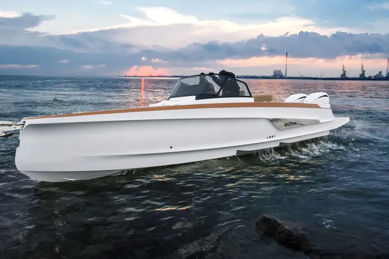 Slide: The Image of 2026 STERK 31 WB Super Sport boat cruising on water at sunset. - 19