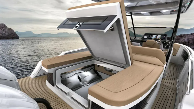 Slide: The Image of 2026 STERK 31 WB Super Sport boat with open storage, luxurious seating, and scenic ocean view. - 28