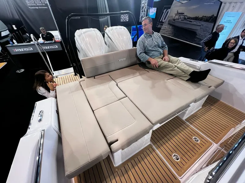 Slide: The Image of 2026 STERK 31 WB Super Sport boat with spacious seating and teak flooring at a boat show. - 37