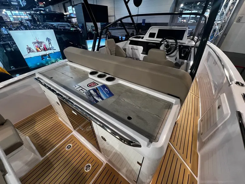 Slide: The Image of 2026 STERK 31 WB Super Sport boat interior with modern helm and wooden deck. - 45