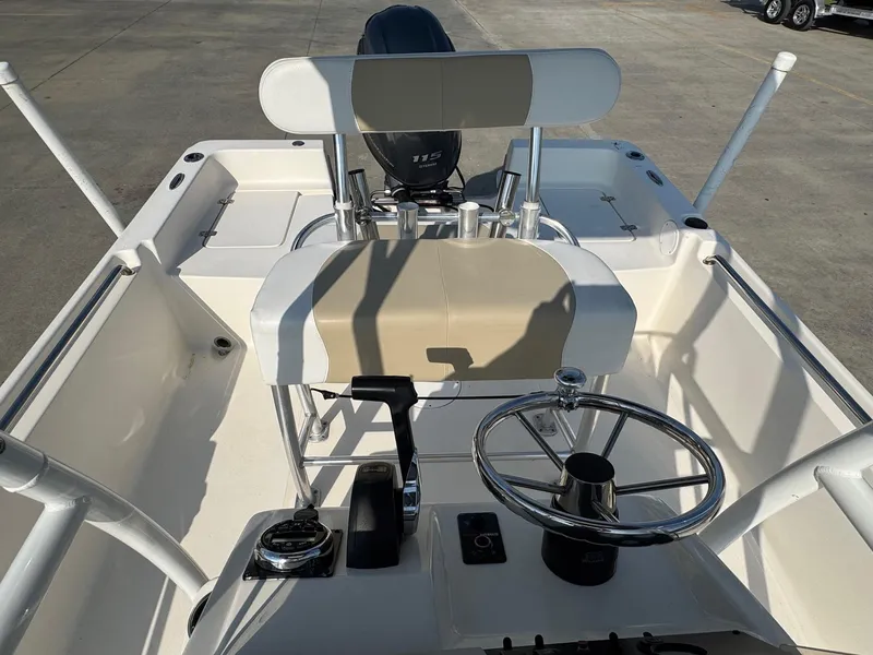 Slide: The Image of 2019 Bulls Bay 2000 boat interior with steering wheel and seating, viewed from above. - 17