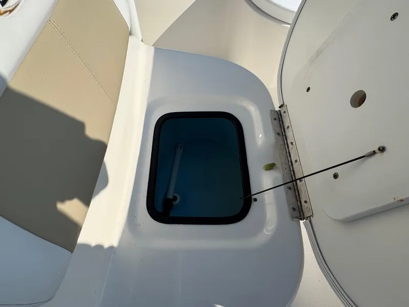 Slide: The Image of Open storage compartment on a 2019 Bulls Bay 2000 boat, showing interior details. - 18