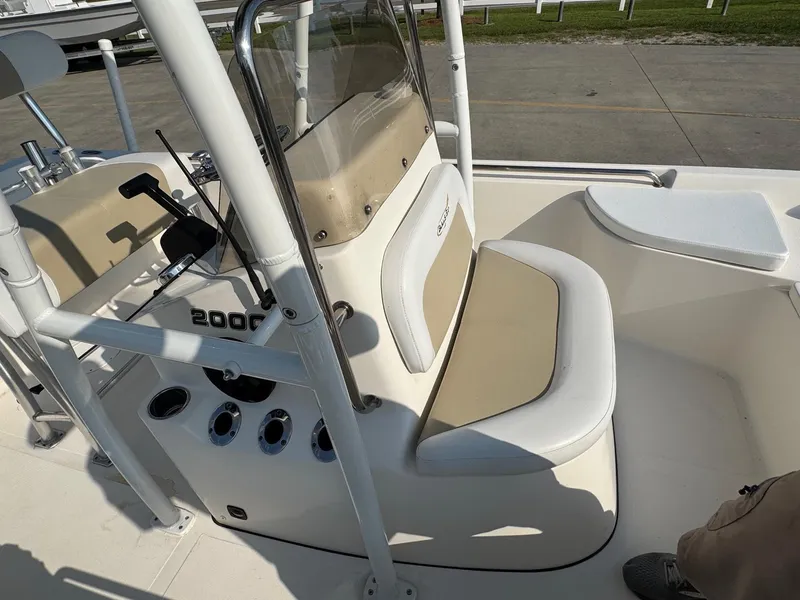 Slide: The Image of 2019 Bulls Bay 2000 boat interior with beige seating and control panel. - 19