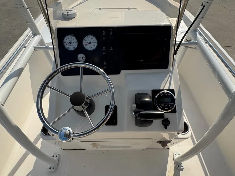 Slide: The Image of 2019 Bulls Bay 2000 boat console with steering wheel and gauges. - 8