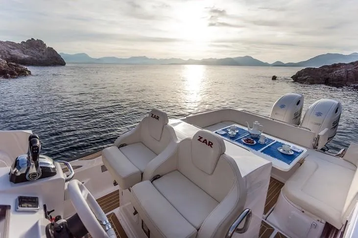 Slide: The Image of 2025 Zar Formenti 85 SL luxury boat with scenic ocean view at sunset. - 17