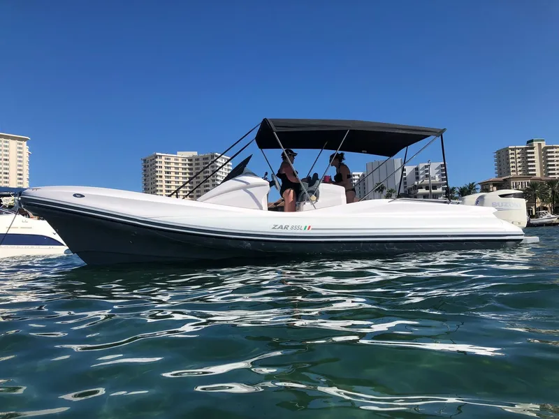 Slide: The Image of 2025 Zar Formenti 85 SL boat on water with cityscape background. - 2