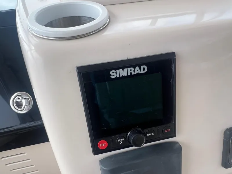 Slide: The Image of Simrad display on 2007 Grady-White Express 330 boat dashboard. - 19