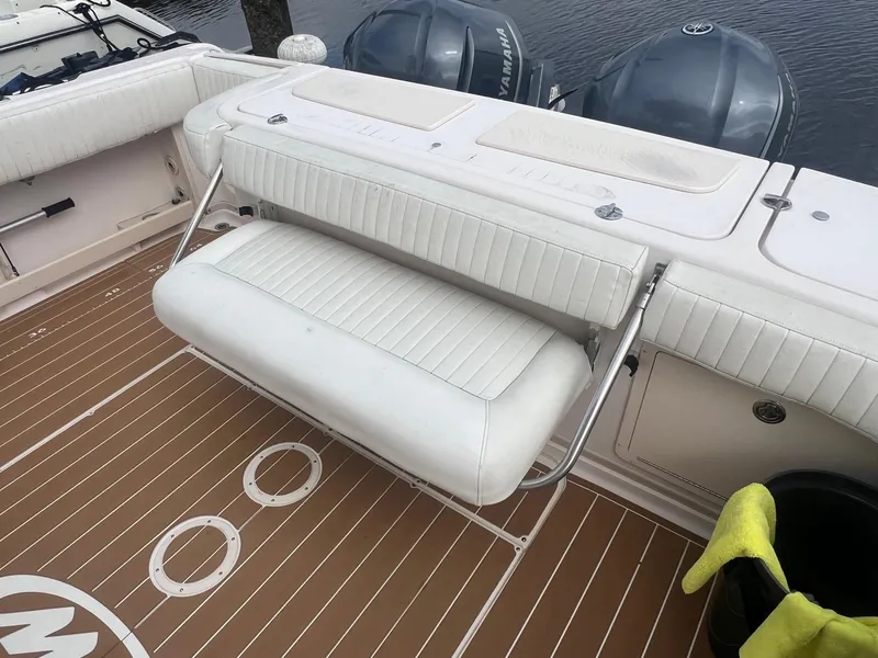 Slide: The Image of 2007 Grady-White Express 330 boat with foldable white bench seat and Yamaha engines. - 5