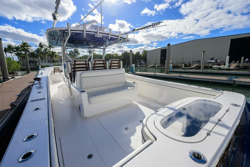 Slide: The Image of 2025 Valhalla Boatworks V-41 luxury boat docked under a sunny sky. - 13