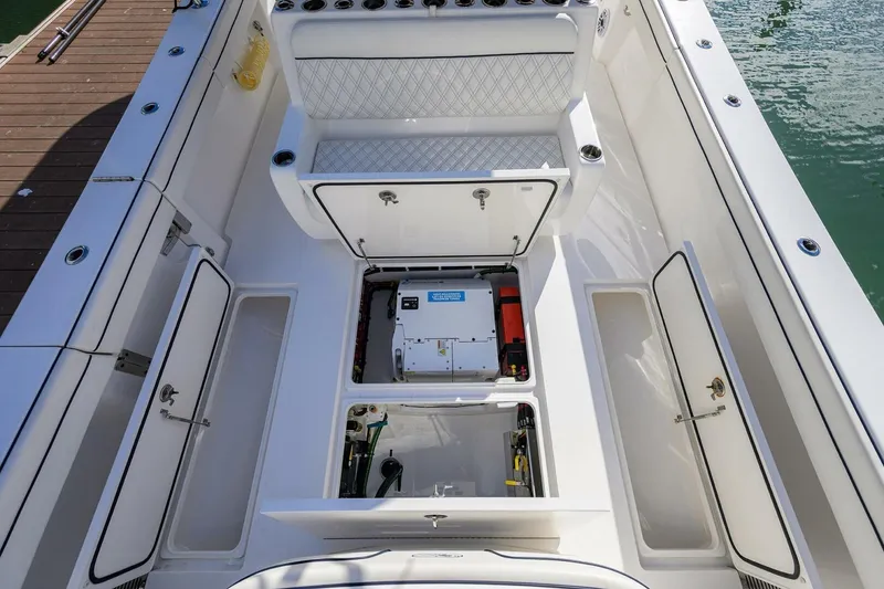 Slide: The Image of 2025 Valhalla Boatworks V-41 interior with open storage compartments and seating. - 18