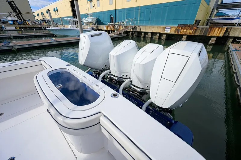 Slide: The Image of 2025 Valhalla Boatworks V-41 with four powerful outboard engines docked at a marina. - 21