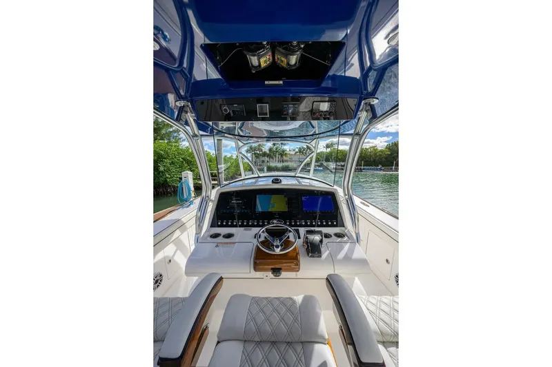 Slide: The Image of 2025 Valhalla Boatworks V-41 helm with advanced navigation system and luxurious seating. - 28
