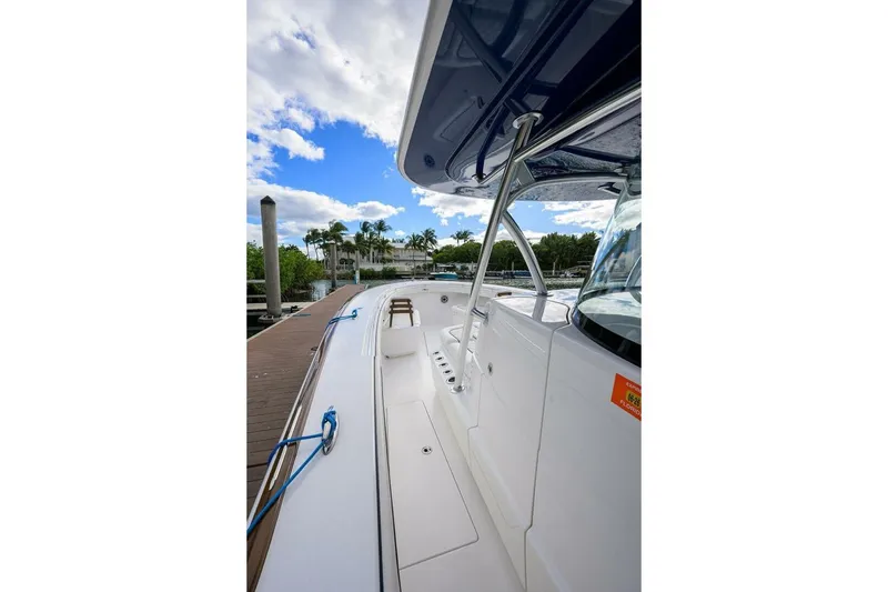 Slide: The Image of 2025 Valhalla Boatworks V-41 docked, showcasing sleek design and spacious deck. - 36