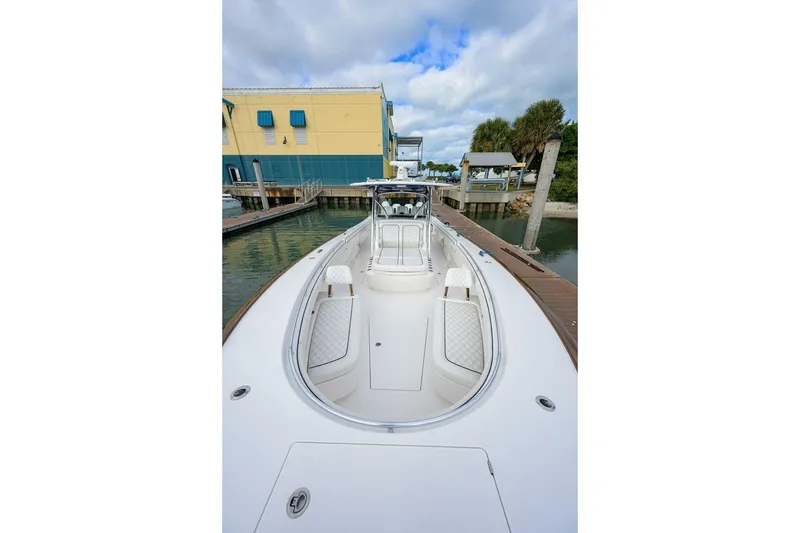 Slide: The Image of 2025 Valhalla Boatworks V-41 docked, showcasing sleek design and spacious deck. - 42