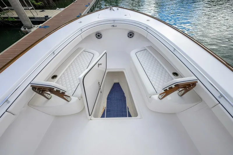 Slide: The Image of 2025 Valhalla Boatworks V-41 interior with white seating and storage compartments. - 46