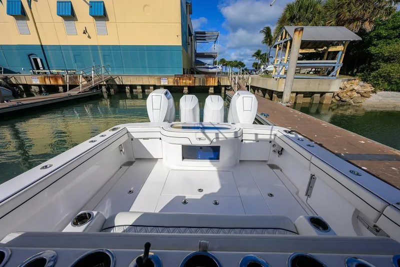 Slide: The Image of 2025 Valhalla Boatworks V-41 at dock, showcasing spacious deck and triple engines. - 5