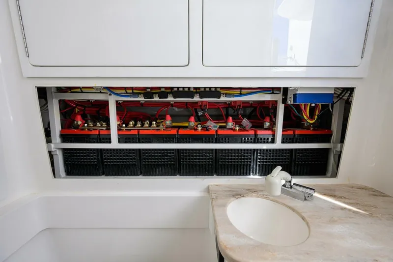Slide: The Image of 2025 Valhalla Boatworks V-41 interior showing battery compartment and sink area. - 52