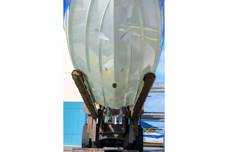 Slide: The Image of 2025 Valhalla Boatworks V-41 hull on lift, showcasing sleek design and craftsmanship. - 54