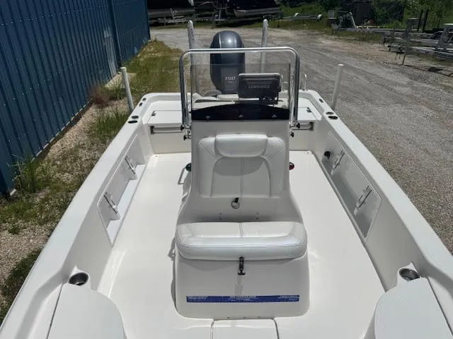 Slide: The Image of 2016 Blue Wave 2200 PureBay boat, white interior, center console, outdoor setting. - 20