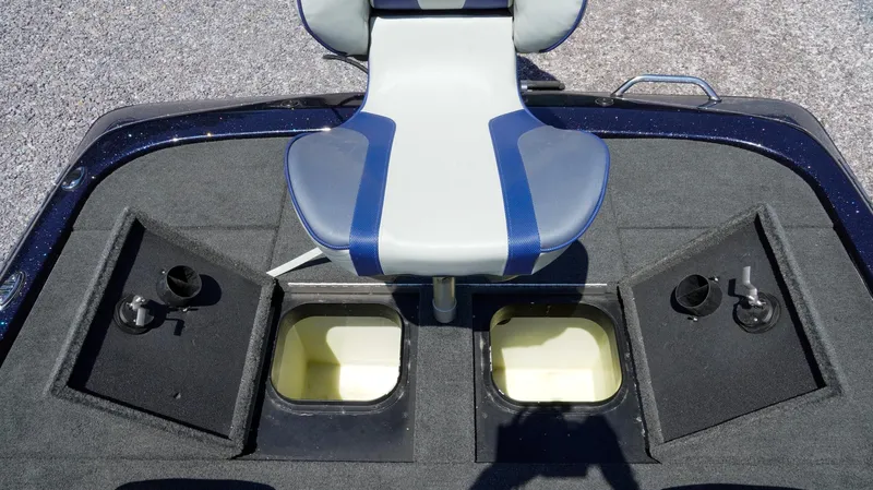 Slide: The Image of 2021 Skeeter ZX200 boat deck with storage compartments and a blue-gray seat. - 11