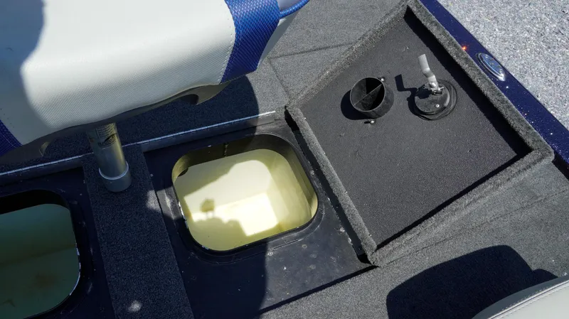 Slide: The Image of 2021 Skeeter ZX200 boat interior with open storage compartments and seating. - 13