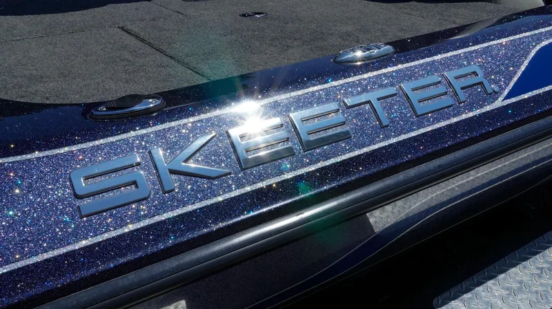 Slide: The Image of 2021 Skeeter ZX200 boat with sparkling blue finish and prominent logo. - 19