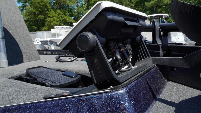 Slide: The Image of 2021 Skeeter ZX200 boat with advanced control panel and wiring, set against a sunny backdrop. - 31