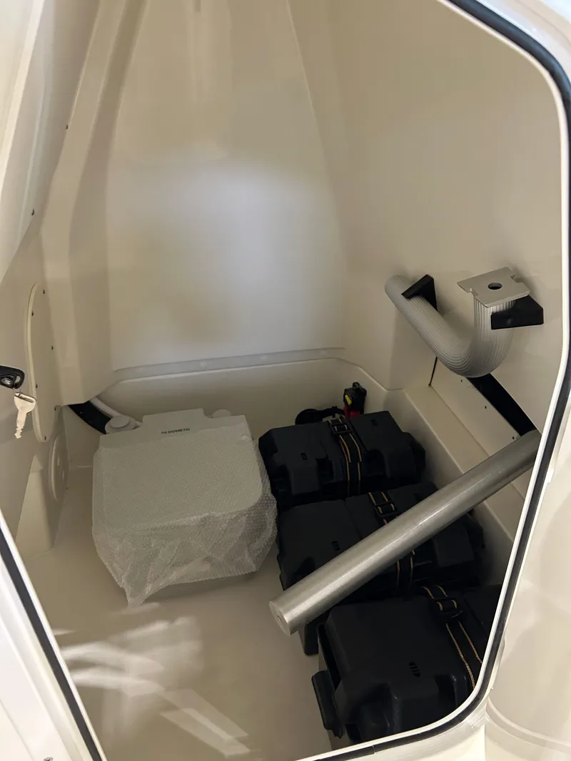 Slide: The Image of Interior storage compartment of 2025 Boston Whaler 220 Dauntless boat. - 10