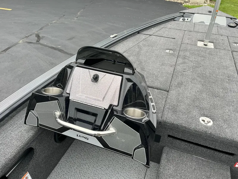 Slide: The Image of 2026 Lund 1875 Pro-V Bass XS boat interior with cup holders and storage compartments. - 16