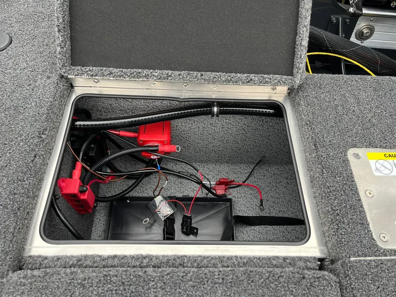 Slide: The Image of Open battery compartment of 2026 Lund 1875 Pro-V Bass XS boat. - 20