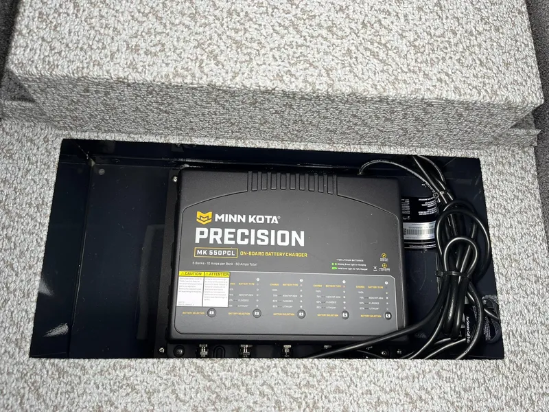 Slide: The Image of Minn Kota Precision MK 550PCL on-board battery charger in 2026 Lund 1875 Pro-V Bass XS. - 22