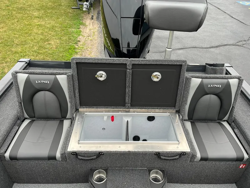 Slide: The Image of 2026 Lund 1875 Pro-V Bass XS boat interior with seating and storage compartments. - 9