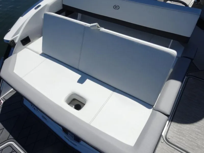 Slide: The Image of 2024 Cobalt R6 boat with white cushioned seating and integrated storage compartment. - 12