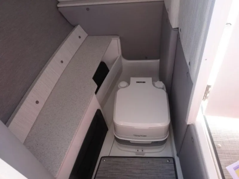 Slide: The Image of 2024 Cobalt R6 boat interior with compact marine toilet. - 19
