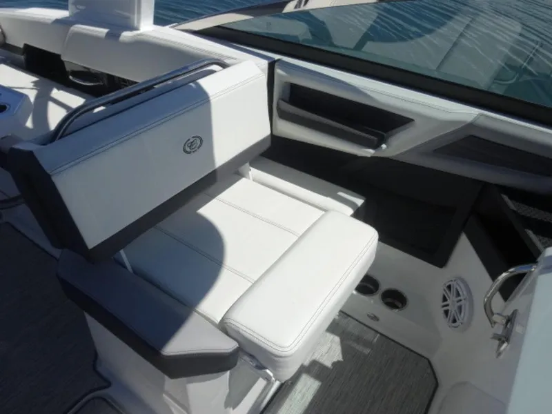 Slide: The Image of 2024 Cobalt R6 boat interior with white seating and modern design elements. - 20