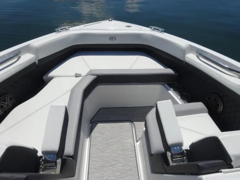 Slide: The Image of 2024 Cobalt R6 boat interior with sleek seating and modern design on calm water. - 26