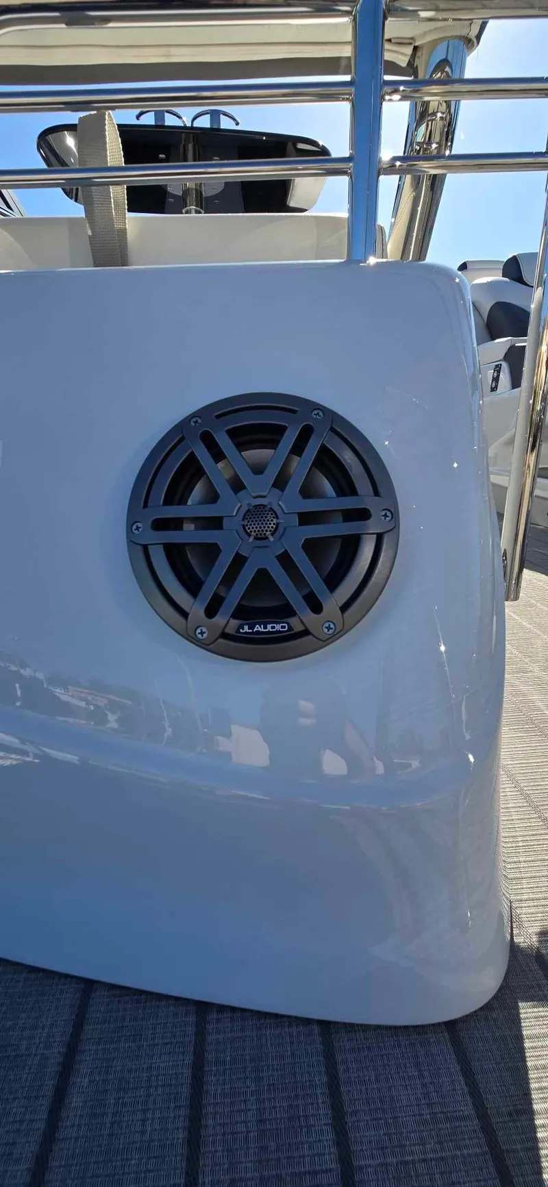 Slide: The Image of 2025 Manitou 25 LX SRW boat with JL Audio speaker on deck. - 22