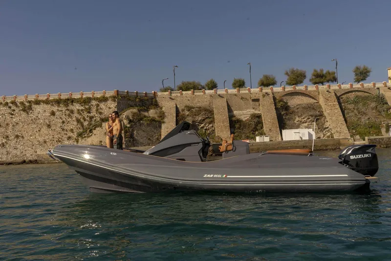 Slide: The Image of 2025 Zar Formenti 95 SL boat on water near stone wall. - 10