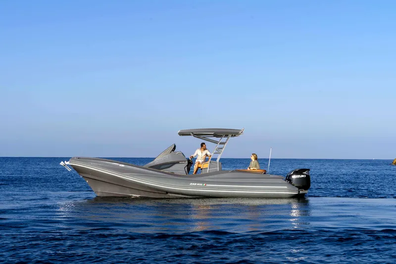 Slide: The Image of 2025 Zar Formenti 95 SL boat cruising on calm blue waters. - 4