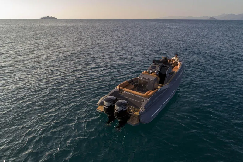 Slide: The Image of 2025 Zar Formenti 95 SL luxury boat on open water at sunset. - 6