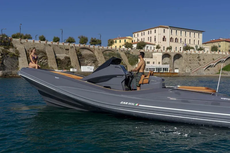 Slide: The Image of 2025 Zar Formenti 95 SL boat cruising near historic waterfront buildings. - 7