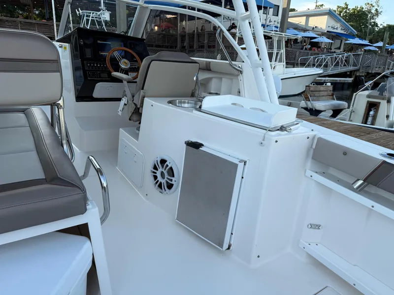 Slide: The Image of 2020 Cutwater C-24 DC boat interior with foldable seating and storage compartments. - 11