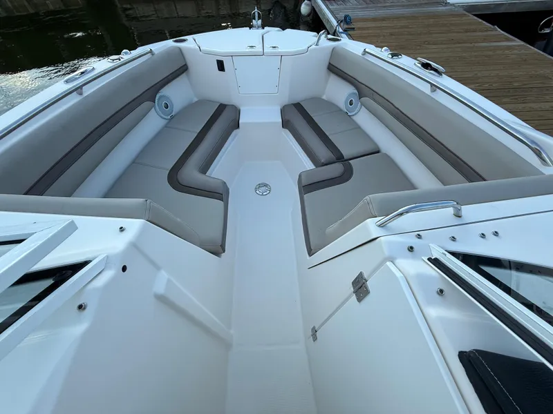 Slide: The Image of 2020 Cutwater C-24 DC boat interior with seating, helm, and storage features. - 13