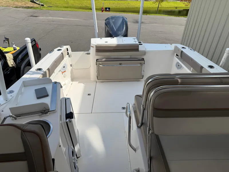 Slide: The Image of 2020 Cutwater C-24 DC boat interior seating with cushioned bench and armrests. - 15