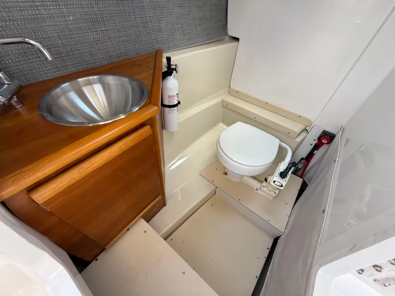 Slide: The Image of 2020 Cutwater C-24 DC boat interior with seating and dock view. - 22