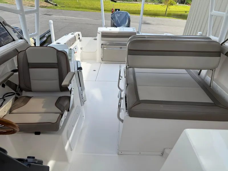 Slide: The Image of 2020 Cutwater C-24 DC boat stored indoors, showcasing sleek design and structure. - 24