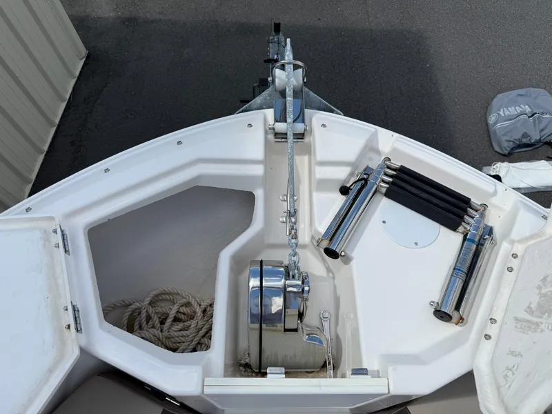 Slide: The Image of 2020 Cutwater C-24 DC with Yamaha four-stroke outboard engine in a garage. - 29