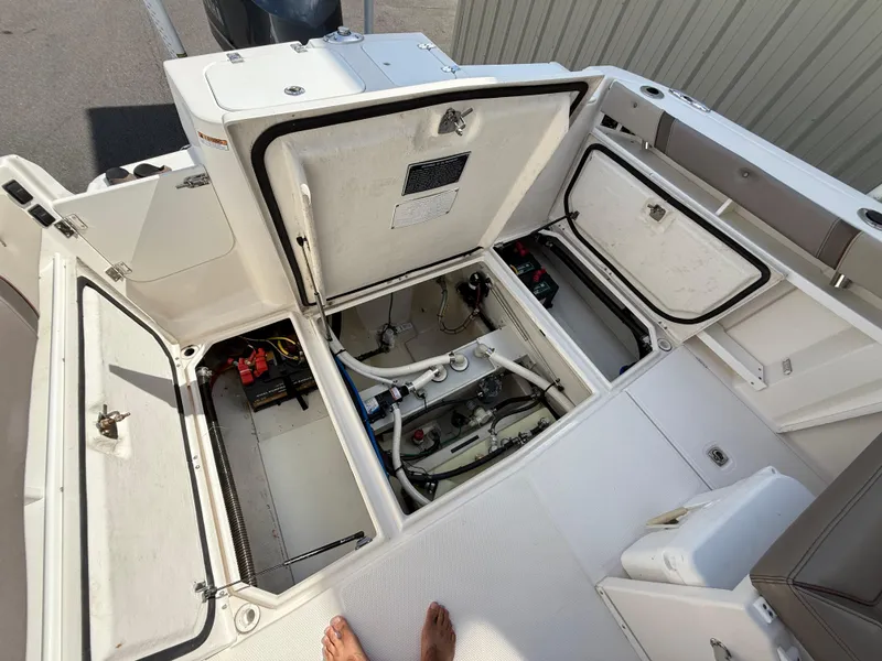 Slide: The Image of 2020 Cutwater C-24 DC boat interior with seating, control panel, and cup holders. - 30