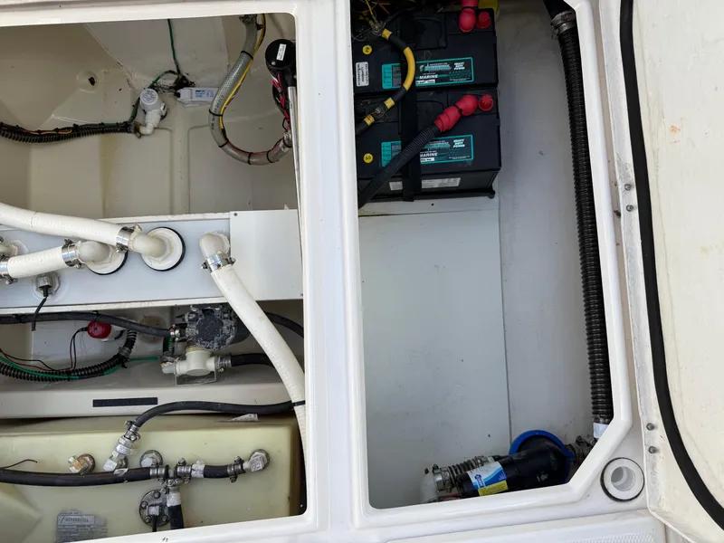 Slide: The Image of 2020 Cutwater C-24 DC boat interior with blue lighting in storage facility. - 33