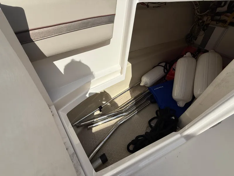 Slide: The Image of 2020 Cutwater C-24 DC boat interior with illuminated cockpit and seating at a marina. - 34